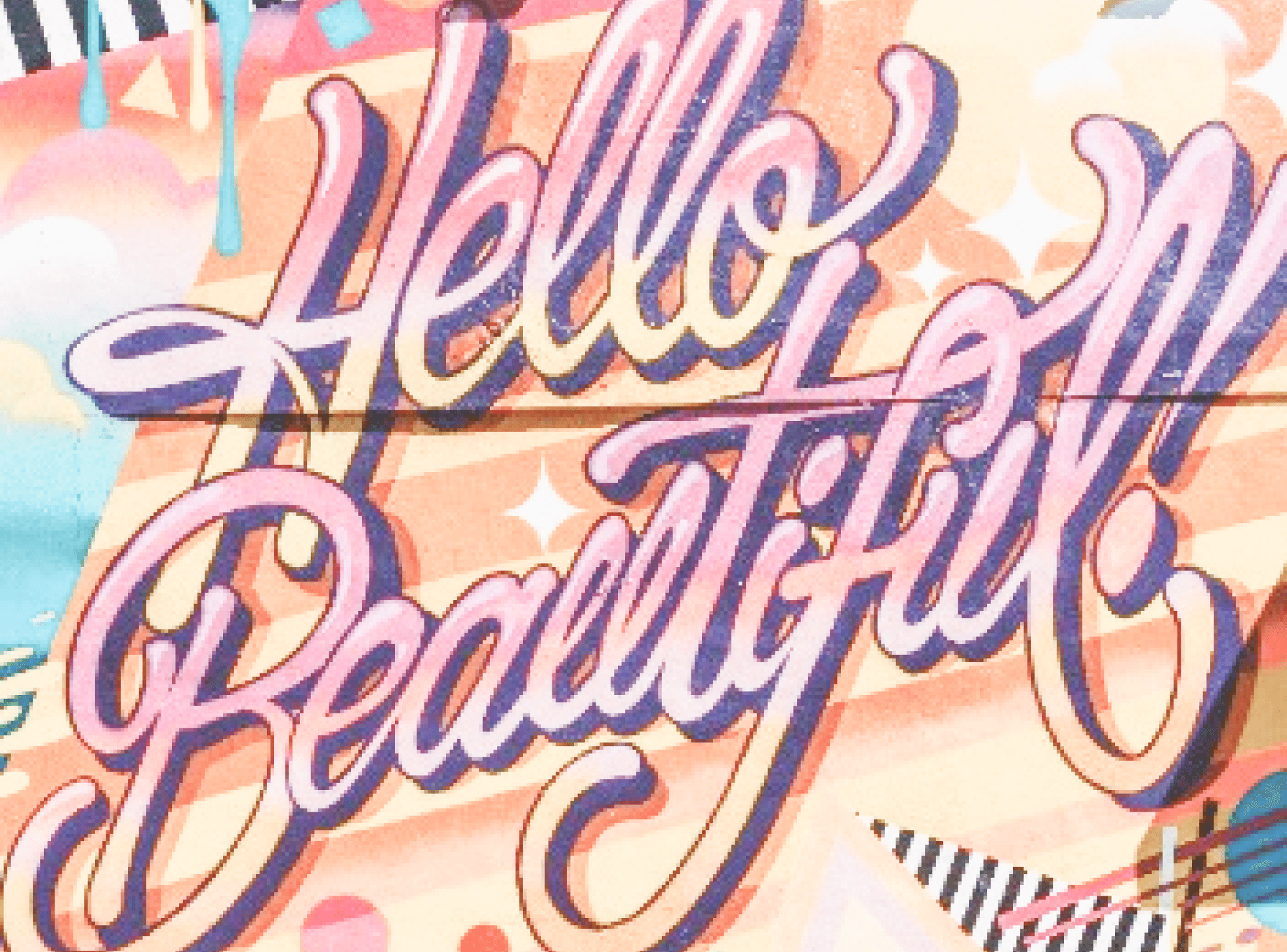 A photo of a mural with 'hello beautiful' words.